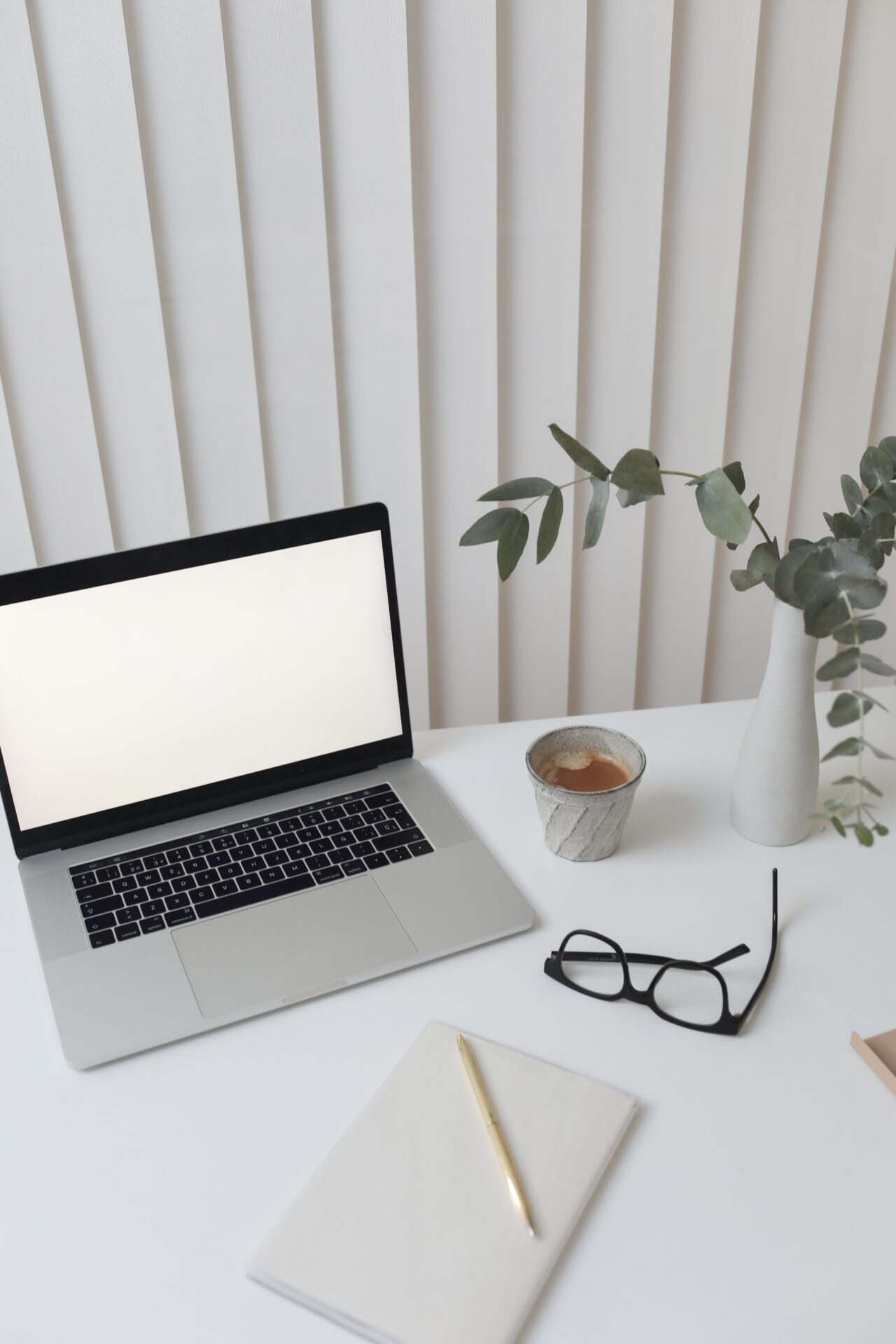 laptop, book and pen, glasses