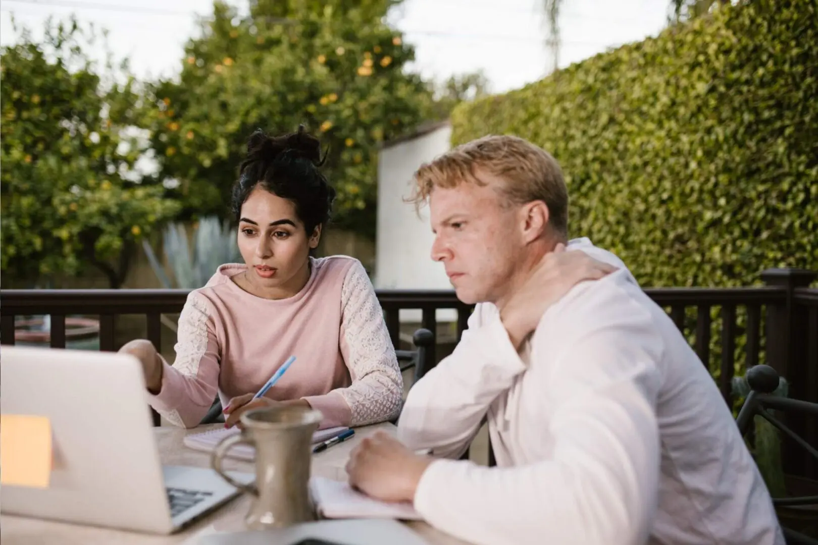 Two people talking on a project on a project